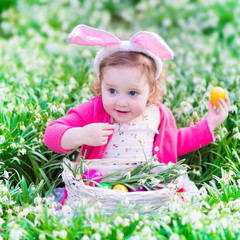 Little girl on Easter egg hunt
