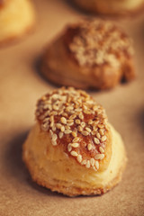 Fresh homemade salty scones with cheese and sesame