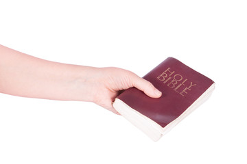 hand holds the Bible