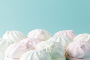 Pastel colored marshmallow  on aquamarine bright background