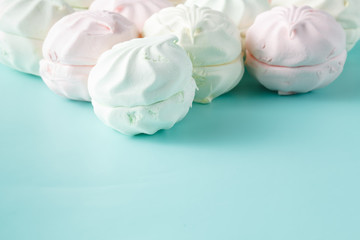 Pastel colored marshmallow  on aquamarine bright background