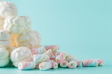Fototapeta na wymiar Colorful marshmallow hill on aquamarine background