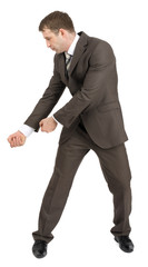 Businessman holding invisible axe