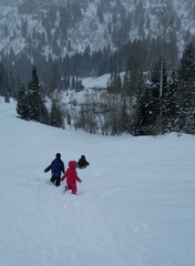 Kids in snowy mountains