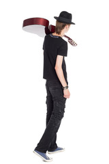 Young guitarist with guitar rear view