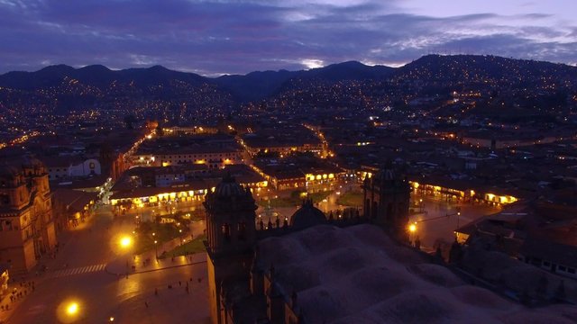 Flight over Cusco main square at blue hour