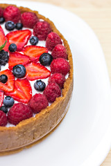 Cheesecake with fresh berries o the table