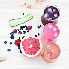 Fresh colorful lemonade (pink, purple, orange)  in glasses