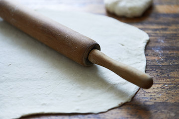 Fototapeta na wymiar dough and rolling pin