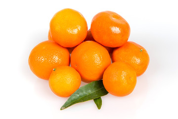 Fototapeta na wymiar A lot of tangerines on a white background, juicy, ripe tangerines, orange mood