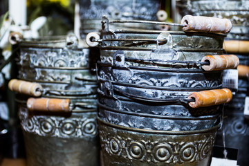 water is coming out of a bucket with holes