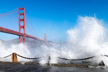 Wall murals San Francisco Golden Gate Bridge. Dramatic big ocean waves 