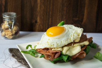 Breakfast sandwich, croque madame with fried egg with ham and me