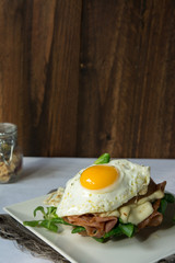 Breakfast sandwich, croque madame with fried egg with ham and me