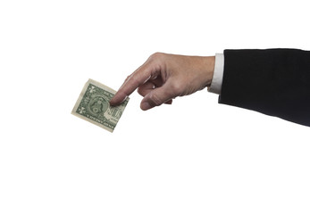 Isolation against white background of suited man's hand holding dollar bill between forefingers