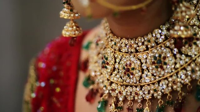Tilt up shot of a Indian bride wearing jewelry