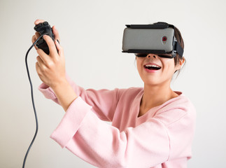 Excite Woman in virtual reality glasses playing the game