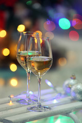 Two glasses of wine on Christmas decoration background