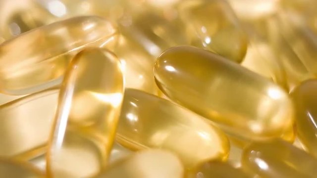 Cod fish liver oil tablets 4k dolly-shot
