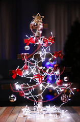 Decorated handmade Christmas tree on a table