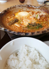 Spicy kim chi soup with fresh tofu, pork and vegetable