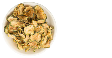 Dried zucchini or courgette in white bowl over white background