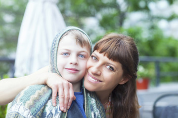 Portrait of an adorable mother hugging her boy