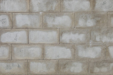 Gray brick wall, unfinished.