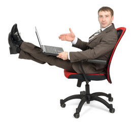 Businessman sitting on chair with laptop