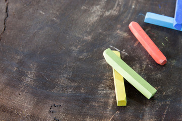 Colored chalk on the wooden nature board