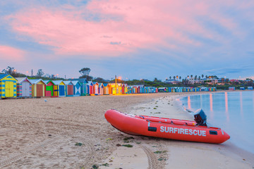 Rescue boat on a beach with huts