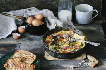 Country breakfast - frittata in a pan and toast.