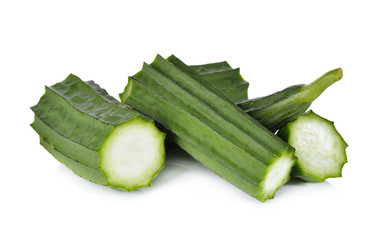 portion cut Fresh Angled luffa on white background