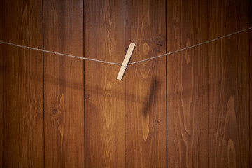 Clothespin on wooden wall