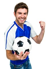 Portrait of smiling man holding football