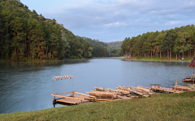 Pang Oung, a serene lake in a valley with surrounded by mountain ranges in Mae Hong Son, Thailand. Bamboo raft for sightseeing around the lake