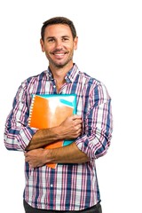 Smiling man standing holding notepads