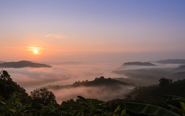 Beautiful sunrise landscape with sea of fog above Mekong river at Phu Huai Isan mountain viewpoint in Nong Khai Province, Thailand