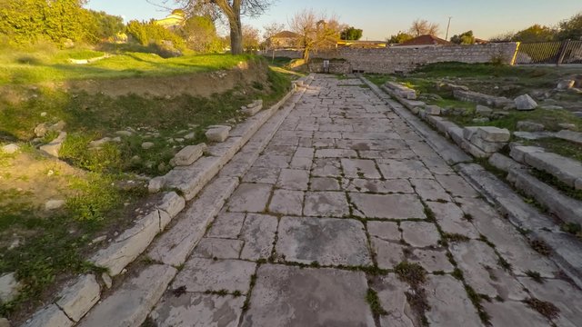 Flying over the ancient road with the Apollon Temple view in a distance. The Holy Road, Didim, Turkey. Aerial, 4k.