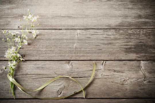bunch of gypsophila on old wooden table