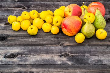 Various fruits isolated on wooden background.