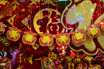 Traditional Chinese new year decorations. The main character means luck. The small Chinese characters mean happy and prosperous new year.