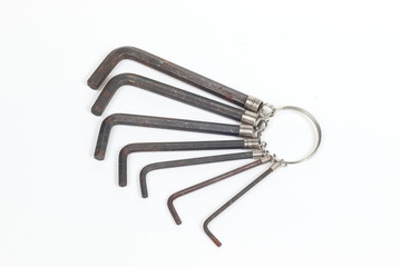 Old hex key wrench set isolated on white background.