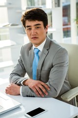 Fototapeta premium Asian businessman in his office