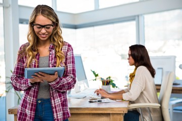 Two girls work at office