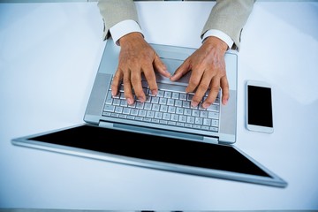 close up view of a businessman using his labtop