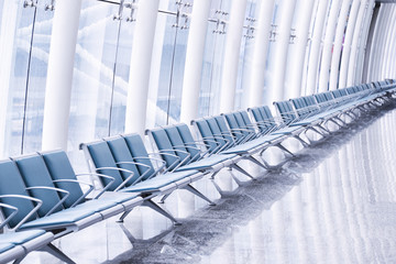 row of green chair at airport