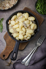 Italian potato gnocchi with mushrooms sauce and cheese