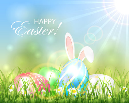 Easter background with multicolored eggs and rabbit