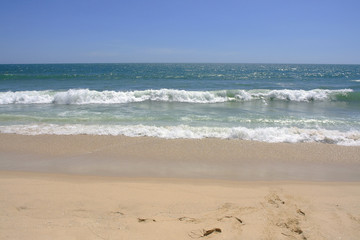 Fototapeta na wymiar Empty sea and sandy beach background with copy space